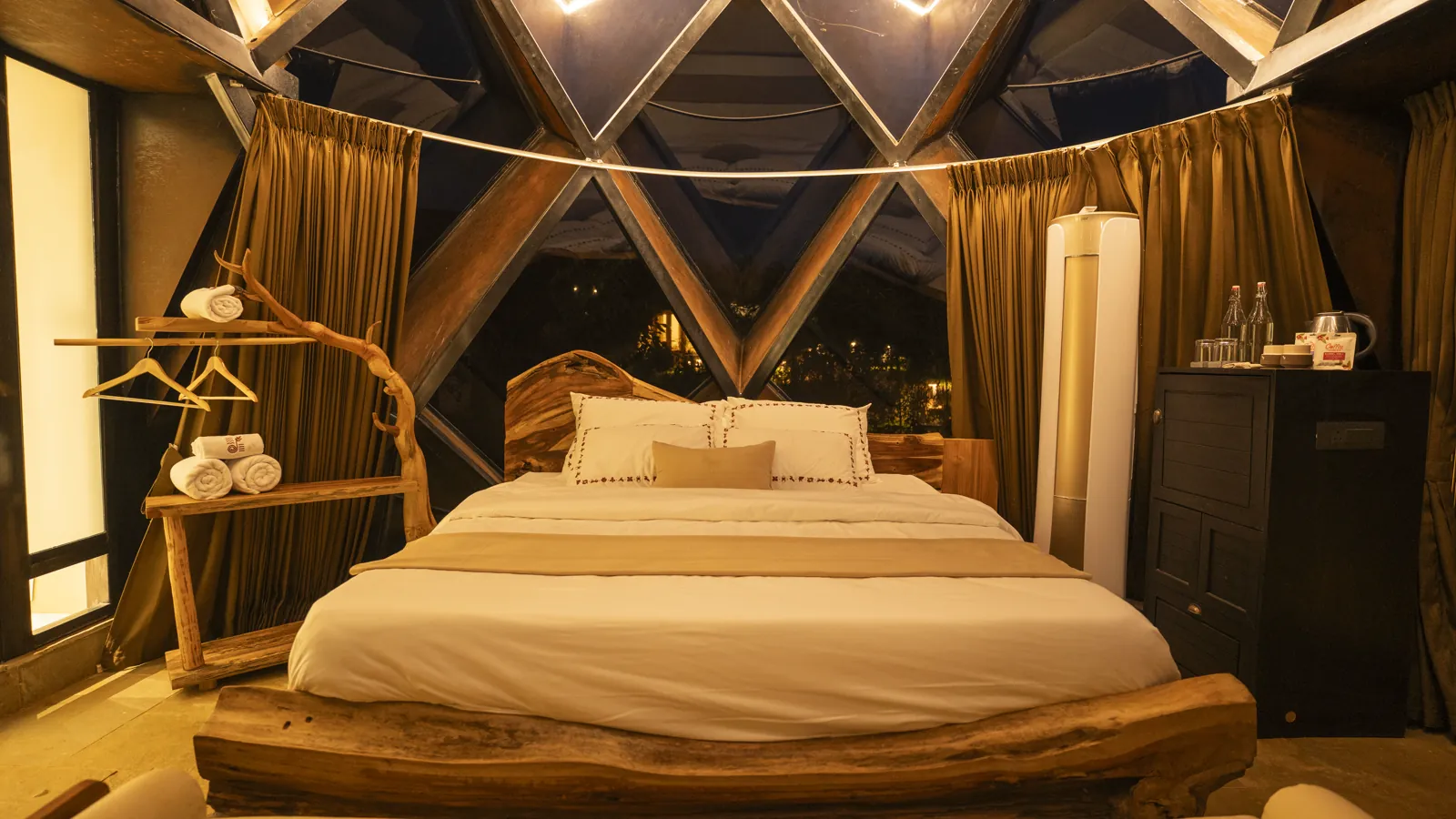 The Amber Chamber — the bed beneath the glass dome