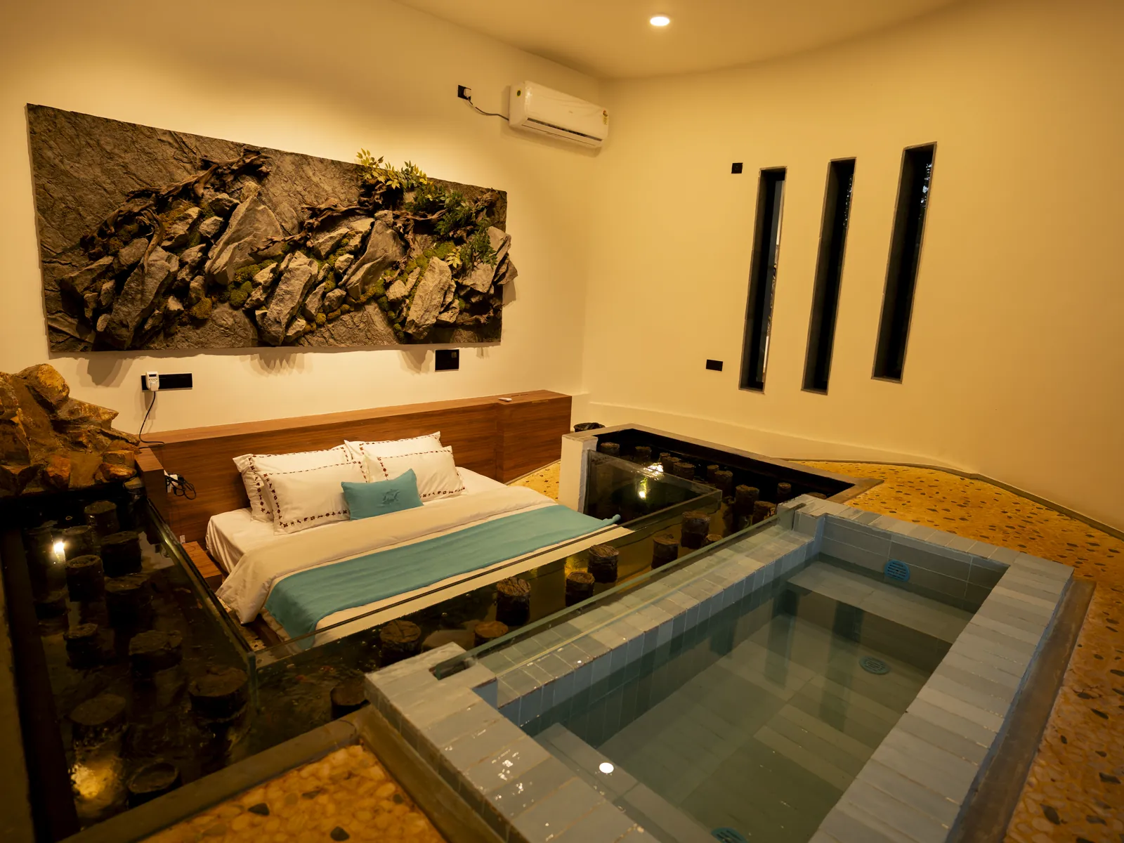 The Aqua — the bed beside the dip pool