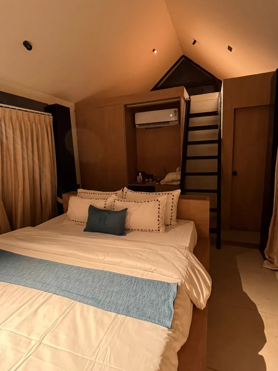 The Cocoon — the bedroom beneath the A-frame window