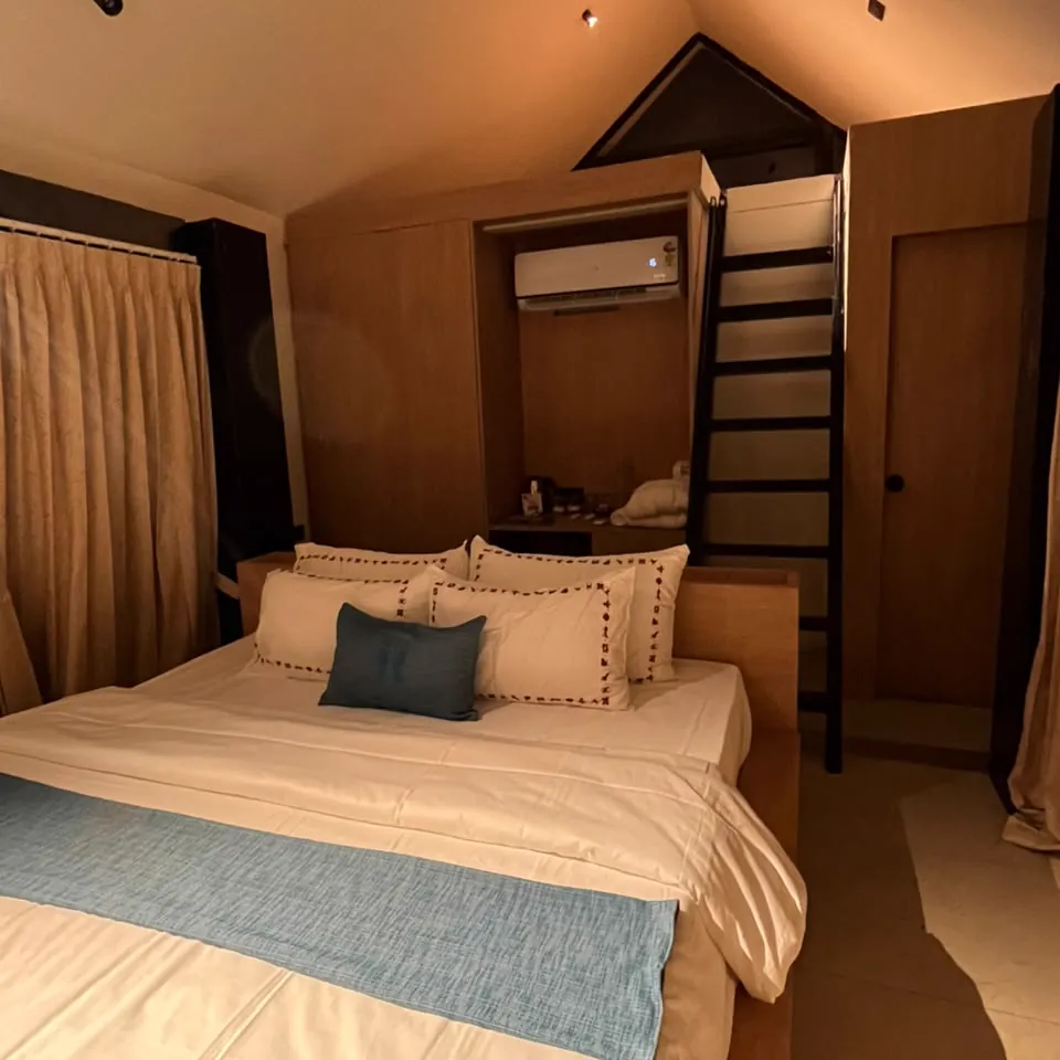 The Cocoon — the bedroom beneath the A-frame window