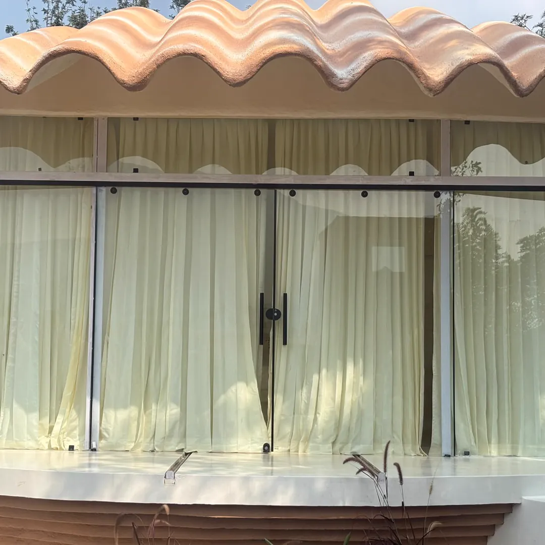 The Shore — exterior, the shell opening onto the garden