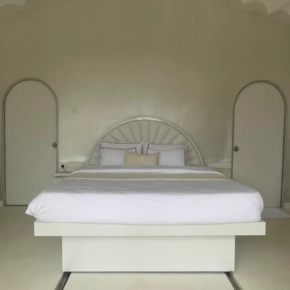 The Shore — the bed beneath its shell-shaped headboard
