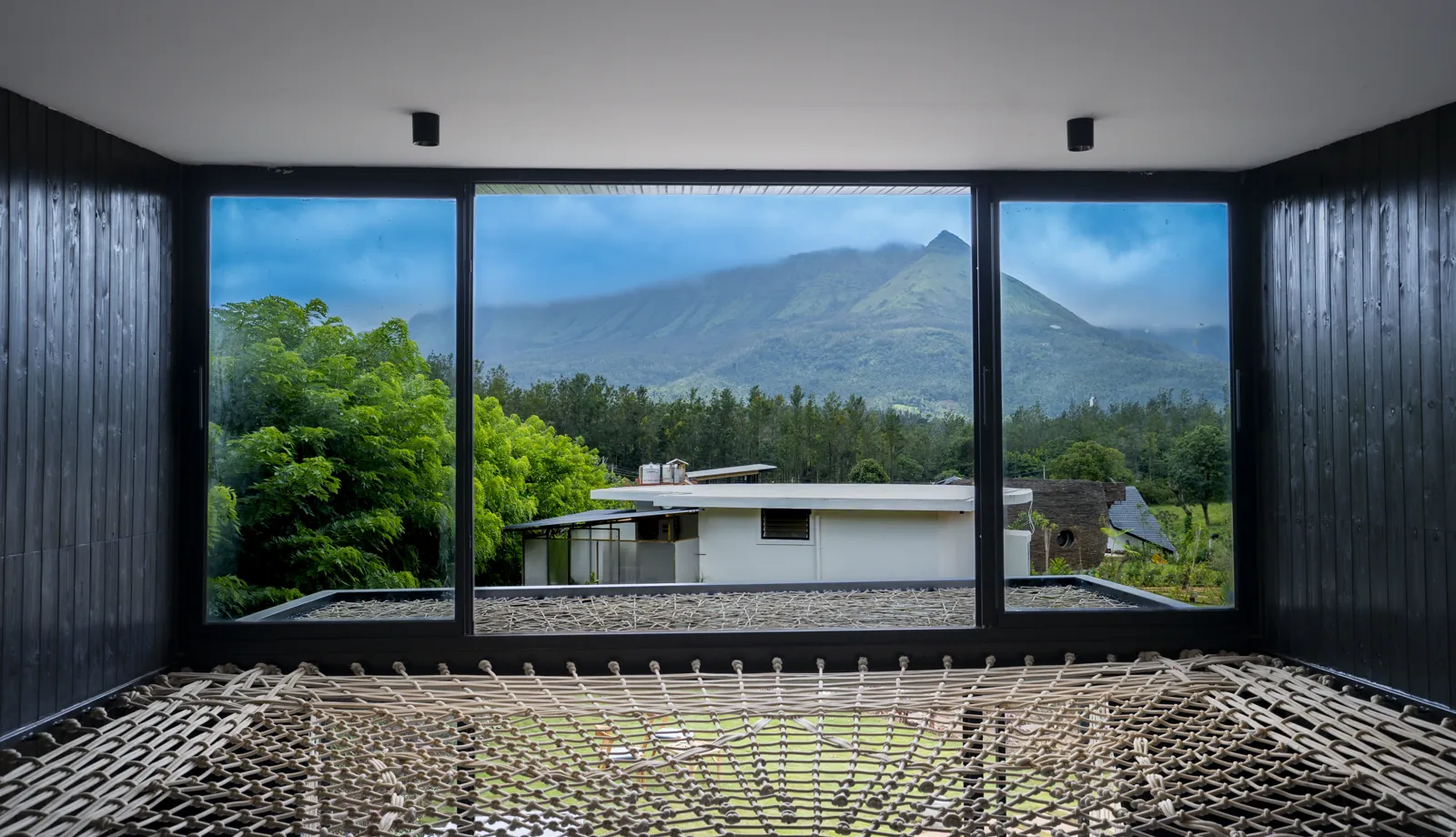 The Weave — the hammock floor and the mountains beyond